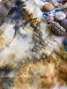 some rocks and stones are laying on the ground next to each other with different colors