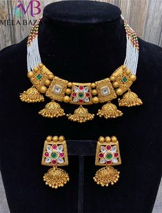 Exquisite handmade fitted necklace from 'Jaipur'. Kundan inspired stones in a beautiful, high quality setting on premium brass base! Matching earrings included. Multicolor Brass Jewelry With Intricate Design, Fusion Style White Jewelry Sets For Festivals, White Kundan Necklace With Matching Earrings In Temple Style, Fusion Gold Necklaces With Matching Earrings, Multicolor Brass Jewelry For Celebration, Ceremonial Necklace Set With Earrings For Festivals, Ceremonial Festive Necklace With Matching Earrings, Festive Multicolor Brass Jewelry, Multicolor Brass Jewelry For Festivals