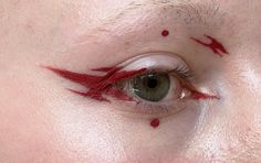 Red graphic liner with dots Red Liner Looks, Punk Graphic Liner, Red Graphic Makeup, Graphic Makeup Eyeliner, Red Eyeliner Makeup Looks, Makeup With Dots, Red Liner Makeup, Red White Makeup, Flame Eyeliner