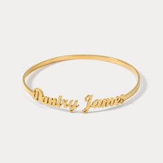 Be on top of the fashion game with this personalized cuff bracelet! Add your name or a special phrase for a unique look that's sure to turn heads. Not to mention the compliments that’ll be rolling in! (Ain't no outfit complete without it!) DETAILS Plating: 18K Gold Materials: 18K Gold on Steel Measurements:  Adjustable 2.76"*2.76"(7cm*7cm) Weight:  7.0 g * Please allow 15-20 days for customing before shipping Adjustable Gold Letter Bracelet, Adjustable Letter-shaped Gold Bracelet, Trendy Personalized Gold Name Bracelet, Gold Letter Bracelets For Personalized Gift, Trendy Gold Name Bracelet For Personalized Gift, Adjustable Gold Bracelets With Names, Personalized Gold Letter Bracelets, Meaningful Gold Bangle Cuff Bracelet, Customizable Adjustable Gold Name Bracelet