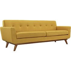 a yellow couch sitting on top of a wooden frame