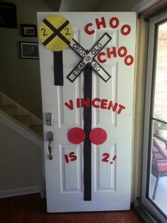 a door decorated to look like a railroad crossing with the words choo choo and innocent is 2