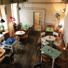 an empty restaurant with several tables and chairs