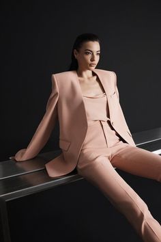 These elegant pants feature a slim leg and floor length design, crafted from crepe fabric for a sophisticated look. Perfect for any occasion, these pants offer a flattering and chic silhouette for the modern woman. Coral Jacket, Elegant Pants, Straight Cut Pants, Knitwear Outfit, Elegant Pant, Happy Clothes, Crepe Blazer, Mean Blvd, Slim Leg Pants