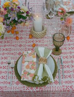 a table set with place settings and napkins