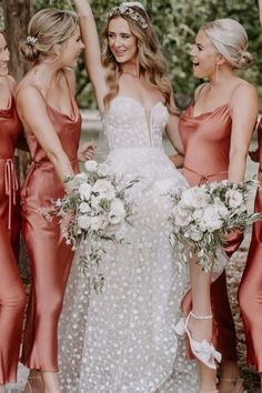 the bride and her bridesmaids are all dressed in red