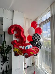 the balloons are in the shape of cars