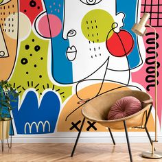 a room with a large mural on the wall next to a chair and planter