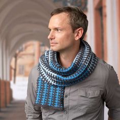 a man wearing a blue and white scarf