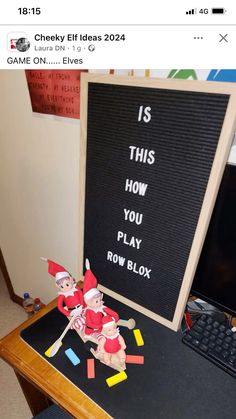 a computer desk with a sign that says is this how you play row blox