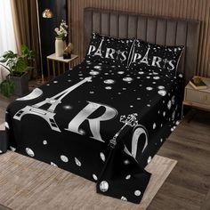 the paris bedding set is black with white stars and eiffel tower on it