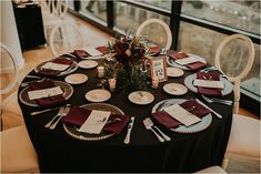 the table is set with place settings for dinner