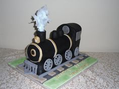 a cake shaped like a train on top of a table