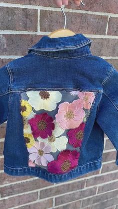 • 2T • Embroidered Floral Denim Jacket – The Lace Anchor Spring Cotton Outerwear With Floral Applique, Fitted Spring Denim Jacket With Multicolor Embroidery, Spring Denim Jacket With Multicolor Embroidery, Cute Spring Denim Jacket With Patches, Cute Denim Jacket With Patches For Spring, Casual Cotton Outerwear With Floral Applique, Cute Long Sleeve Denim Jacket For Spring, Spring Denim Jacket With Multicolor Floral Embroidery, Fall Cotton Outerwear With Floral Applique