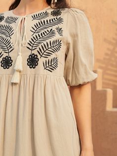 Beige Embroidered Dress With Short Sleeves, Embroidered Puff Sleeve Spring Dresses, Spring Embroidered Puff Sleeve Dresses, Beige Short Sleeve Embroidered Dress, Casual Embroidered V-neck Dress, Summer V-neck Embroidered Dress With Intricate Embroidery, Peasant Style V-neck Embroidered Dress, Embroidered Tie, Tie Neck Dress