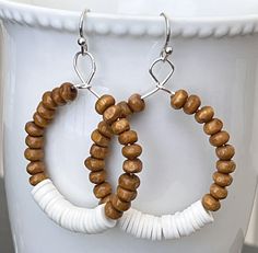 White Heishi and Brown Wooden Beads and Silver Hoop Earrings. Light Weight Enjoy~ *purchase multiple items and save on shipping!!! 2+ pair = $3.98 shipping 5+ pair = FREE shipping Please visit my store to check out all of my items: http://stores.ebay.com/LOVEbeadsboutique Heishi Bead Jewelry Ideas, Wooden Jewelry Handmade, Wooden Bead Earrings, Wooden Bead Jewelry, Wood Beads Jewelry, Artisan Jewelry Earrings, Abalone Earrings, Beaded Earrings Diy, Handcrafted Artisan Jewelry