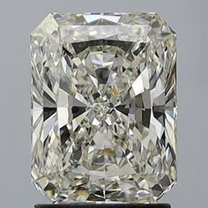 a cushion cut diamond sitting on top of a stand