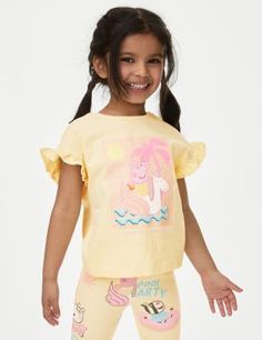 This pure cotton Peppa Pig™ t-shirt is perfect for young fans of the popular TV show. It's designed in a comfy regular fit, with a neat round neck and casual short sleeves. The front features a graphic of Peppa riding an inflatable unicorn at the beach, with glittery details and slogan 'Tropical feeling'. Summer Crew Neck Top For Playwear, Summer Playwear Crew Neck T-shirt, Summer Character Print Tops For Playwear, Playful Summer T-shirt With Character Print, Spring Cartoon Print T-shirt For Playwear, Summer Cartoon Print Playwear T-shirt, Spring Playwear T-shirt With Cartoon Print, Cartoon Print T-shirt For Spring Playwear, Spring Character Print T-shirt For Playwear