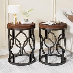 two side tables sitting next to each other in a living room