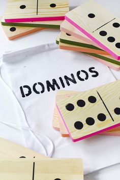 dominos are laid out on top of a white cloth with the word dominos printed on it