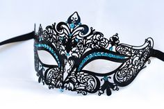 This is a beautiful black laser cut metal masquerade mask with stunning light blue gems. The color of the gems will look gorgeous with matching make up of a beautiful dress!! Very elegant and luxurious! This mask will look even gorgeous as a décor in the house when you are not wearing it! Of this design I do have it in a lot of colors and with different gems but if you wish a different design I have a large variety of masquerade metal laser cut masks in my store. I also have the machine embroide Masqurade Mask, Prom Masquerade, Masquerade Halloween Costumes, Black Masquerade, Black Masquerade Mask, Masquerade Ball Party, Black Halloween Costumes, Prom Costume, Masquerade Costumes