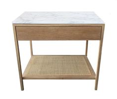 a white marble top end table with wicker bottom and shelf on the left side