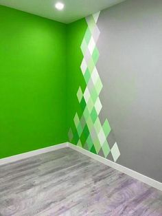 an empty room with green and white walls