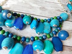 a necklace with blue and green beads on it