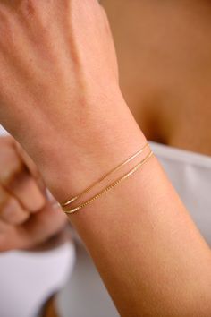 ABOUT PRODUCT A 14K gold box chain bracelet is a sophisticated and stylish accessory made of high quality gold. It features small, square links in a smooth and uniform chain design, making it dainty and delicate. This bracelet is perfect for everyday wear and can be dressed up or down for any occasion. It can be worn on its own as a minimalist statement piece or layered with other bracelets for a more sophisticated look. A 14K gold box chain bracelet is a timeless and elegant choice for women of all ages. 14K Gold Box Chain Bracelet, 0.75mm 1mm Box Chain Bracelet, Shiny Box Chain Anklet, Dainty Layered Bracelet, Simple Chain Bracelet, Gift For Her Him, Christmas, New Year, Mothers Day, Valentines Day, Anniversary, Birthday Gift, Fathers Day, Bridesmaids Gift ITEM DETAILS Material: 14K Gold Box Chain Bracelet, Chain Bracelets Gold Simple For Women, Layered Bracelet, Simple Chain, Dainty Bracelet