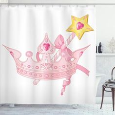 a pink princess crown shower curtain with a star on top in a white bathroom setting