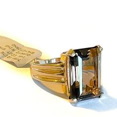 Lady’s 14k gold Smokey Quartz ring. The ring contains a center gemstone that is 18x12mm in diameter. The ring shoulders are 6.5mm and slightly taper. The weight of the ring is 6.8 grams. Size 6.5 and jeweler size-able. Classic Amethyst Ring With Rectangular Stone For Formal Occasions, Formal Fine Jewelry Rings With Rectangular Stone, Classic Rings With Rectangular Stone For Formal Occasions, Modern 14k Gold Topaz Ring For Formal Occasions, Gold Signet Ring With Accent Stones For Formal Occasions, Formal Gold Signet Ring With Accent Stones, Classic Formal Signet Ring With Accent Stones, Formal Topaz Ring With Rectangular Accent Stones, Formal 14k Gold Rings With Rectangular Stone