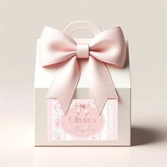 a pink bow on top of a white box