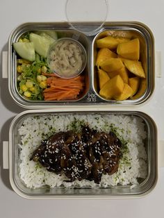 two metal trays filled with rice, meat and veggies