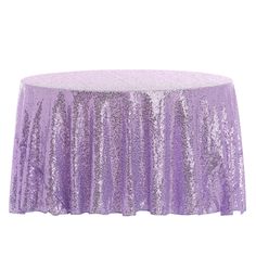 a purple sequin tablecloth on a white background