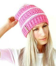 a woman with long blonde hair wearing a pink hat