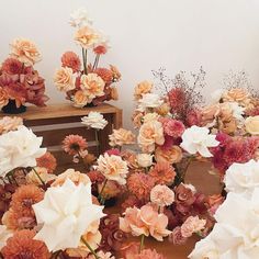 a bunch of flowers that are sitting on a table