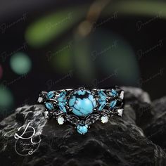 Gothic Black Gold Round Cut Turquoise Engagement Ring Bridal Sets Nature Inspired Cluster Promise Ring Art Deco Leaf Blue Gemstone Branch --->Ring details: - Metal :The underneath metal is in Silver/ 10K/14K/18K white gold, coated with black rhodium - Theme:Romantic Wedding & Engagement - comfortable band - Center Stone :Turquoise - Carat: 6.0mm - Side stone : Turquoise +  moissanite - Side stone:0.48ctw - wedding band :Lab opal + Turquoise+moissanite - 0.12ctw  Materials: - 14k rose gold/14k wh Turquoise Accent Stones Promise Ring, Turquoise Accent Stones Jewelry For Promise Ring, Blue Bohemian Jewelry With Accent Stones, Turquoise Gemstone Jewelry For Promise Ring, Turquoise Multi-stone Promise Ring Jewelry, Turquoise Jewelry With Gemstone Accents For Promise Ring, Blue Bohemian Jewelry With Stone Setting, Turquoise Aquamarine Gemstone Rings, Blue Aquamarine Multi-stone Jewelry