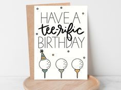 a card with the words have a terrible birthday on it and three balloons in front