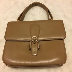 "Vintage Camel colored purse with 1 zippered pocket and 2 open pockets inside. No brand or material labels or markings. Appears to be leather. Has cracking from use, age, and storage but still beautiful. Approximate measurements: 7\" x 8\" x 2.5\" with 4\" handle" Vintage Handheld Satchel With Zipper Closure, Vintage Satchel With Zipper Closure For Daily Use, Daily Use Vintage Satchel With Zipper Closure, Vintage Office Satchel With Detachable Strap, Vintage Beige Shoulder Bag With Zipper Closure, Vintage Briefcase With Detachable Strap And Top Handle, Classic Beige Briefcase With Top Carry Handle, Classic Beige Briefcase With Detachable Handle, Vintage Beige Bag With Zipper Closure