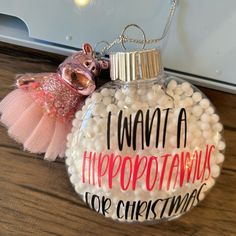 a glass ornament that says i want a hippopotamus for christmas