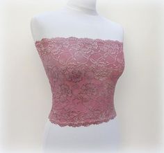 Antique pink lace strapless bandeau top. Floral lace top. Lined tube top. Stretch Lace Tube Top With Lace Trim, Bandeau Tube Top With Lace Trim For Party, Party Bandeau Tube Top With Lace Trim, Lace Tube Top With Built-in Bra For Summer, Elegant Pink Bandeau Tube Top, Feminine Pink Bandeau Tube Top, Pink Bandeau Tube Top Feminine Style, Fitted Strapless Lace Top, Strapless Lace Trim Tube Top For Party