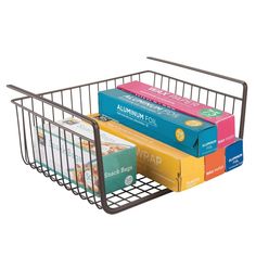 a metal wire basket holds several books