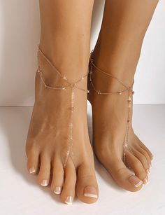 Amanda Rose Gold Barefoot Sandals are a stunning pair of barefoot sandals which features a minimalist design and barely there feel. Handcrafted using 1.5mm cable chain with tiny metal balls which are ingrained into the chain. Lobster clasp closure on the back of the sandals accommodates all foot sizes and does not restrict the movement of your feet. Wear them as a pair or individually. Perfect gift for a true minimalist. Sold as a pair. Gift Wrapped. Ships in 2 business days. All rights reserved Elegant Barefoot Sandals With Single Toe Strap For Beach, Adjustable Barefoot Sandals With Ankle Strap For Party, Adjustable Toe Post Barefoot Sandals For Summer, Elegant Open Toe Barefoot Sandals For Vacation, Elegant Adjustable Toe Loop Sandals, Elegant Barefoot Sandals With Ankle Strap For Vacation, Elegant Spring Barefoot Sandals With Adjustable Fit, Elegant Open Toe Barefoot Sandals For Beach, Elegant Adjustable Toe Ring Sandals