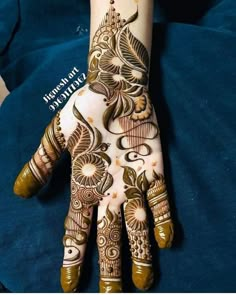 the hand is decorated with henna designs