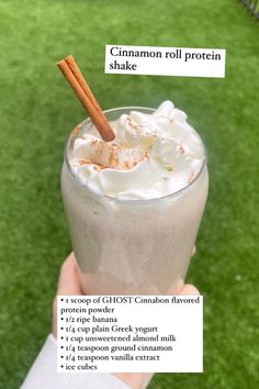 a person holding up a drink with cinnamon in it and information about the ingredients on top