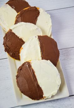 four pieces of chocolate cake on a white plate