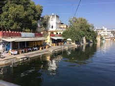 an outdoor restaurant on the side of a river