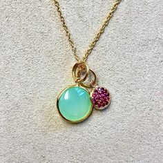 Created in 18 karat yellow gold  Sea-green chalcedony 3.5 cts approx  Ruby 0.10 ct approx  18 inch chain with loops at 16th and 17th inch    A delicate 18-karat-gold necklace is designed to showcase a lustrous 3.5-carat sea-green chalcedony and an accent of 0.10-carat ruby. The chain measures 18 inches in length and features loops at the 16th and 17th inches.    About the Designers ~ Dharmesh & Namrata    Drawing inspiration from little things, Dharmesh & Namrata Kothari have created an extraordinary and refreshing collection of luxurious jewels. True believers of destiny, they always feel that the possibilities of design - and life - are limitless when people work together. Formed in 2003, Syna Jewels has grown through enduring relationships with well known, established companies and have Gold Chalcedony Jewelry For Anniversary, Fine Jewelry In Yellow Gold With Chalcedony, Chalcedony Yellow Gold Jewelry For Anniversary, Yellow Gold Chalcedony Jewelry For Anniversary, Anniversary Yellow Gold Chalcedony Jewelry, Yellow Gold Chalcedony Jewelry Gift, Yellow Gold Chalcedony Necklace As Gift, Elegant Green Gemstone Charm Necklace, Elegant Round Chrysoprase Necklaces