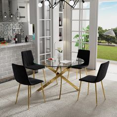 a glass table with four chairs around it