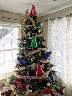 a decorated christmas tree in a living room